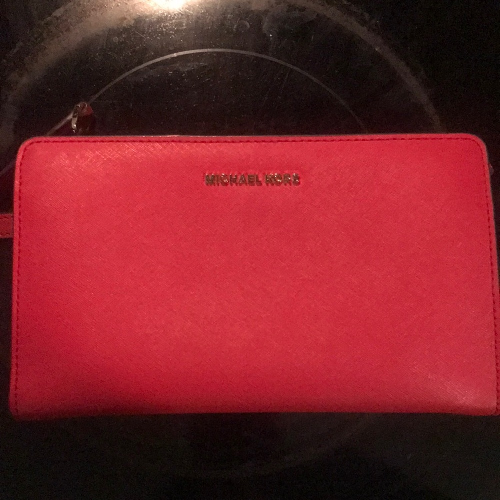 Michael Kors Red purse - Lightly used with two small pen lines on back see pic